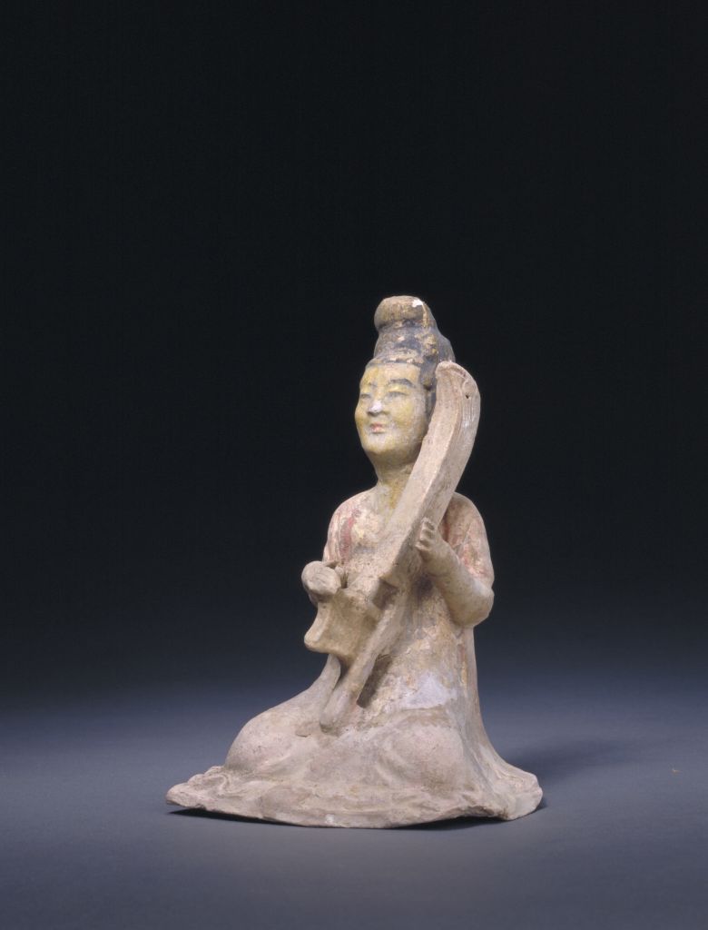 黄釉画彩弹竖箜篌伎乐女陶俑 - 故宫博物院
